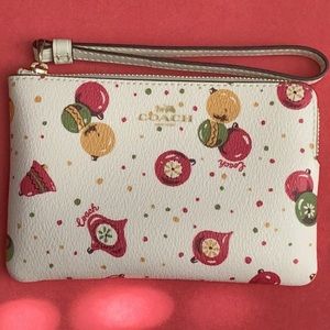 Coach zippered wristlet with Christmas theme